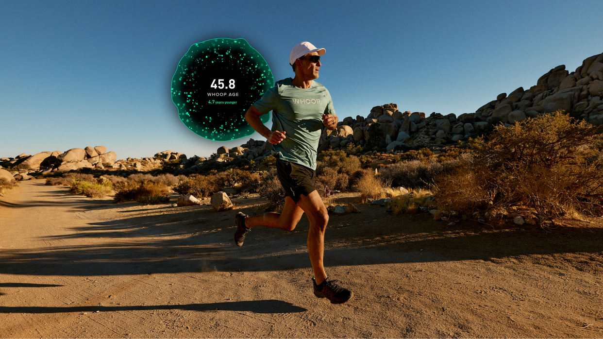 Person running on a desert path with a fitness tracker overlay showing heart rate and steps.